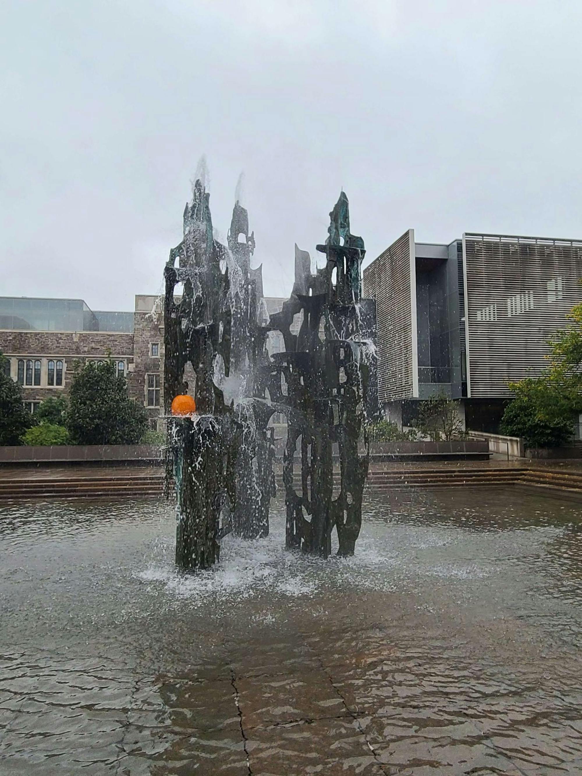 A pumpkin is nested in between the SPIA fountain structure. 