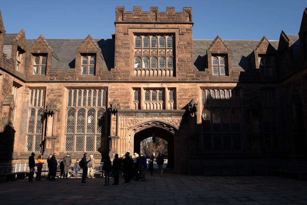 The sunlit arch of East Pyne with people milling about the entrance