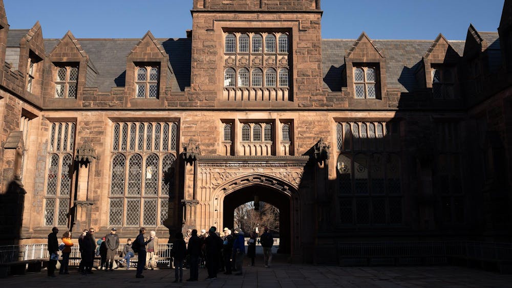 The sunlit arch of East Pyne with people milling about the entrance