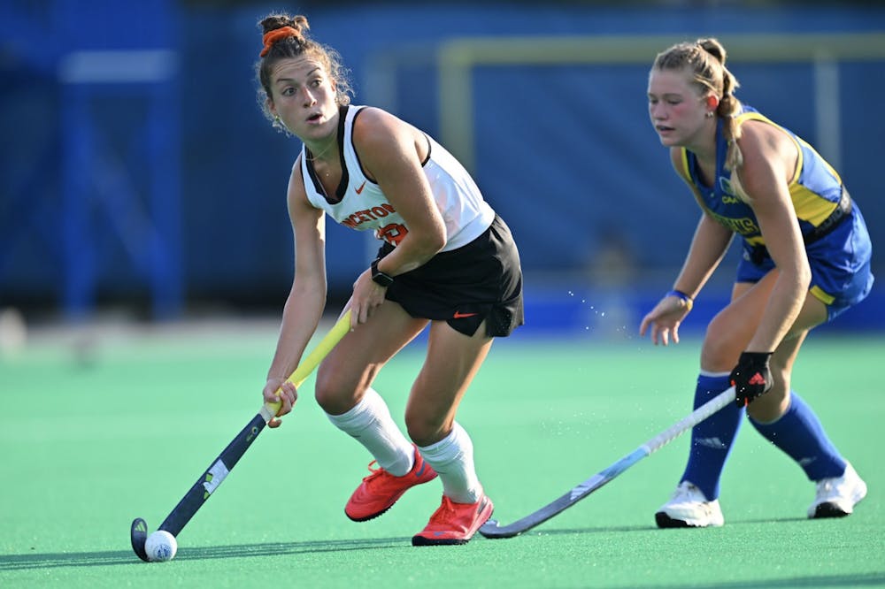 Senior forward Liz Agatucci on the Princeton women's field hockey team getting past a Delaware defender en route to a goal. 