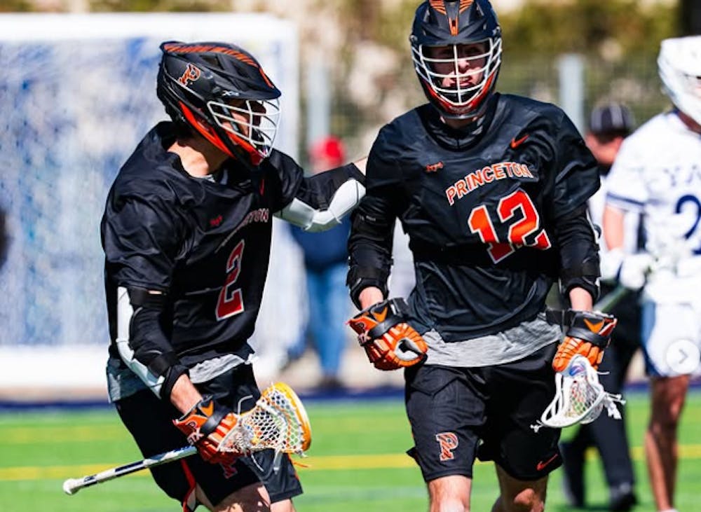 Men's lacrosse players celebrating