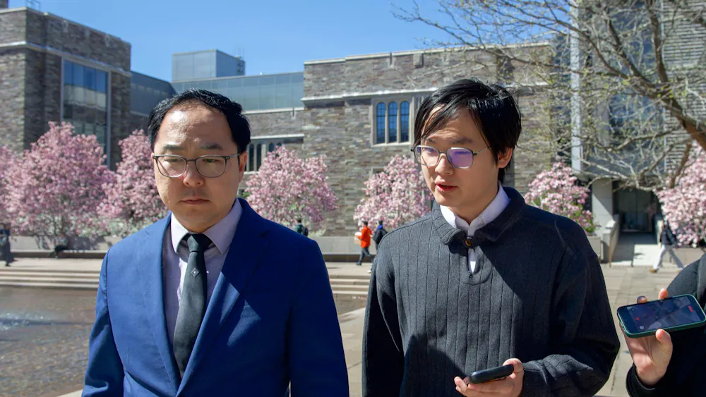 Staff News writer Toby Chang interviewing Sen. Andy Kim by the SPIA Fountain of Freedom.