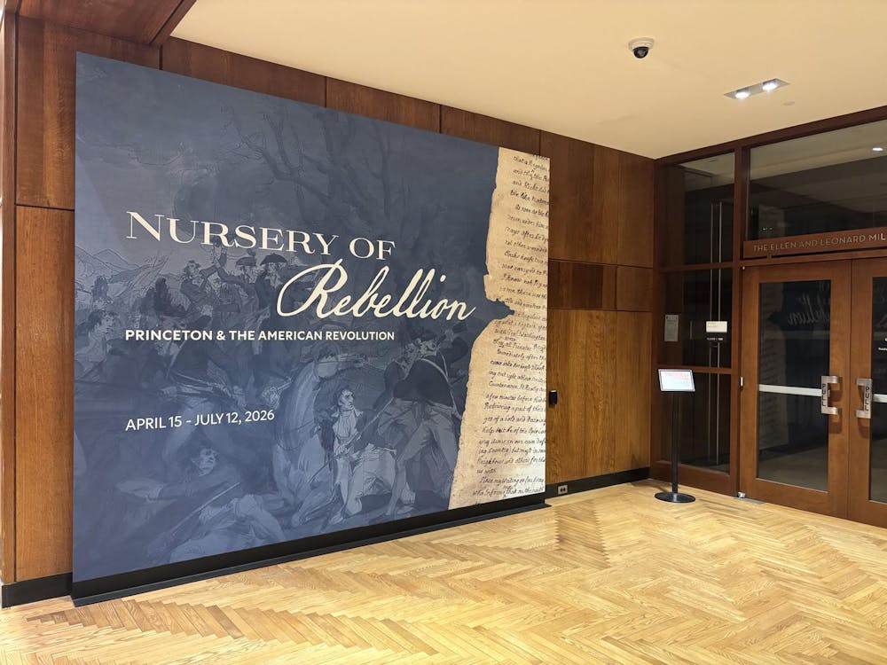 Blue poster against a brown wall in the library lobby. 