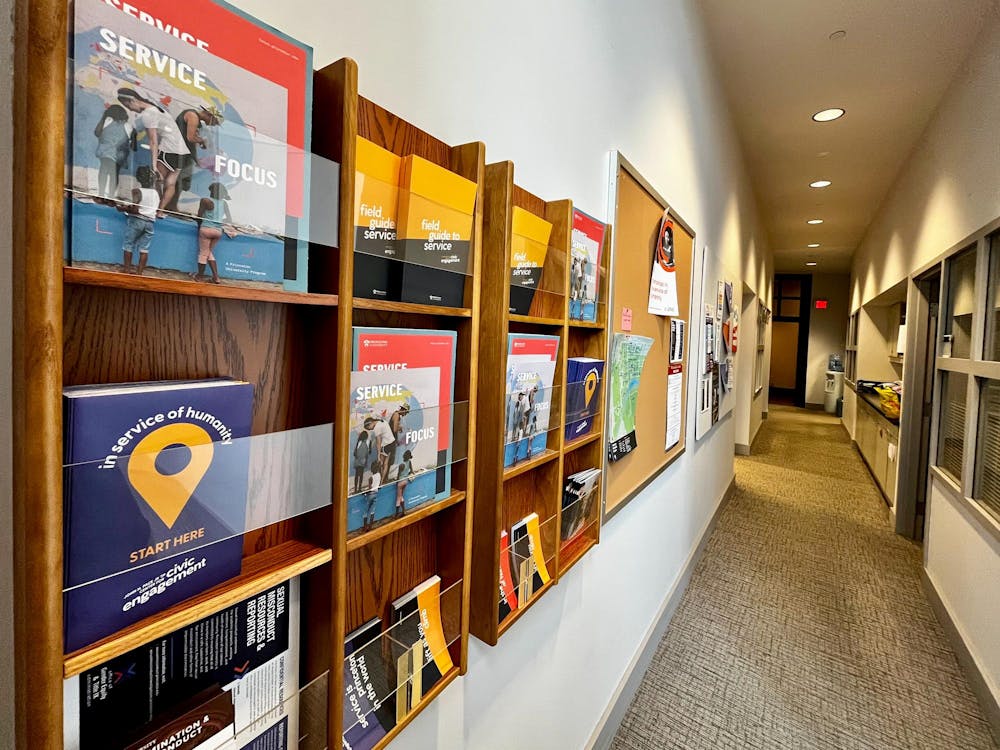 Several shelves with flyers and pamphlets advertising civic service.