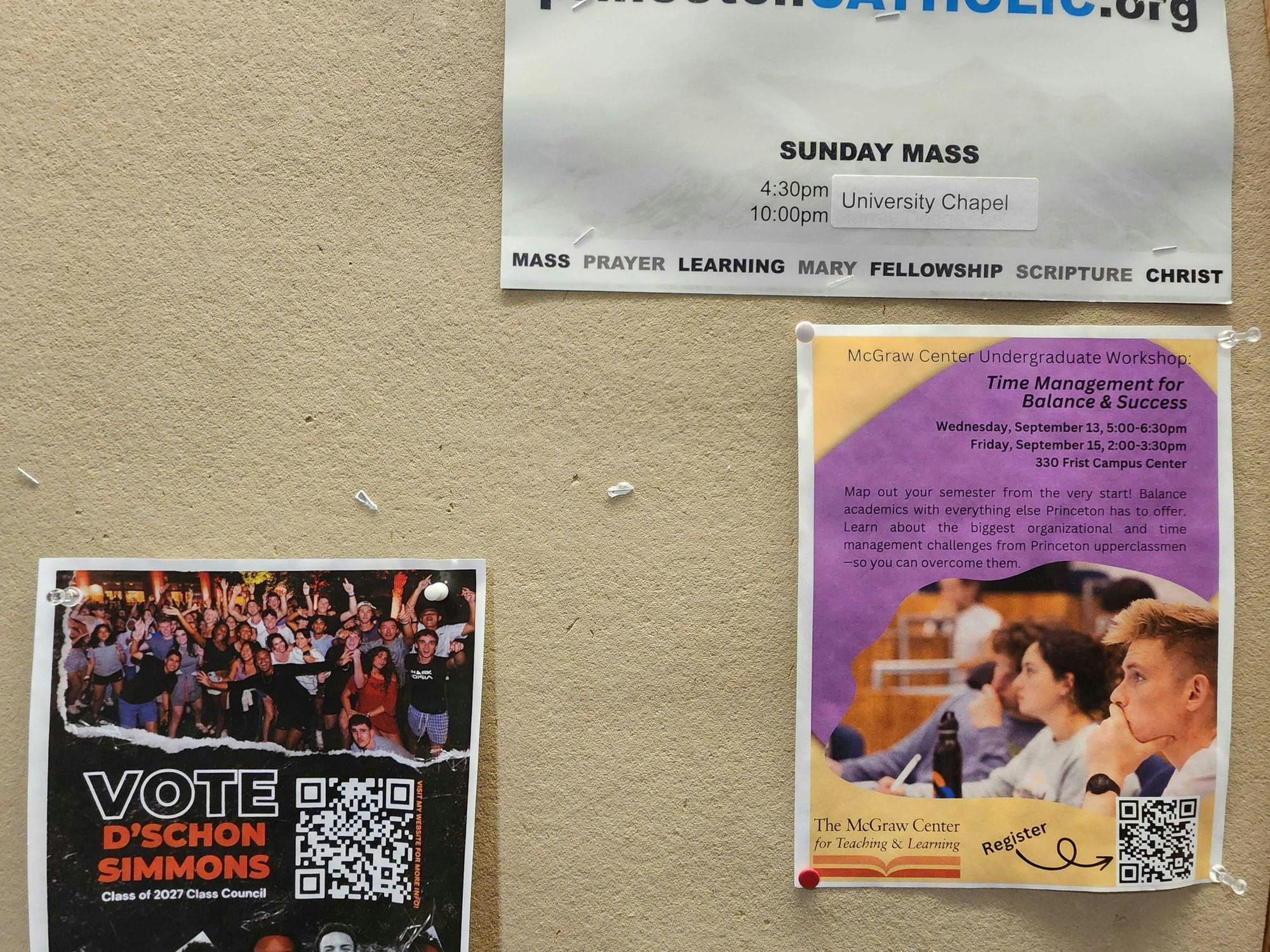 Multicolored posters against a beige board.  One says "Vote D'Schon Simmons Class of 2027 Class Council"