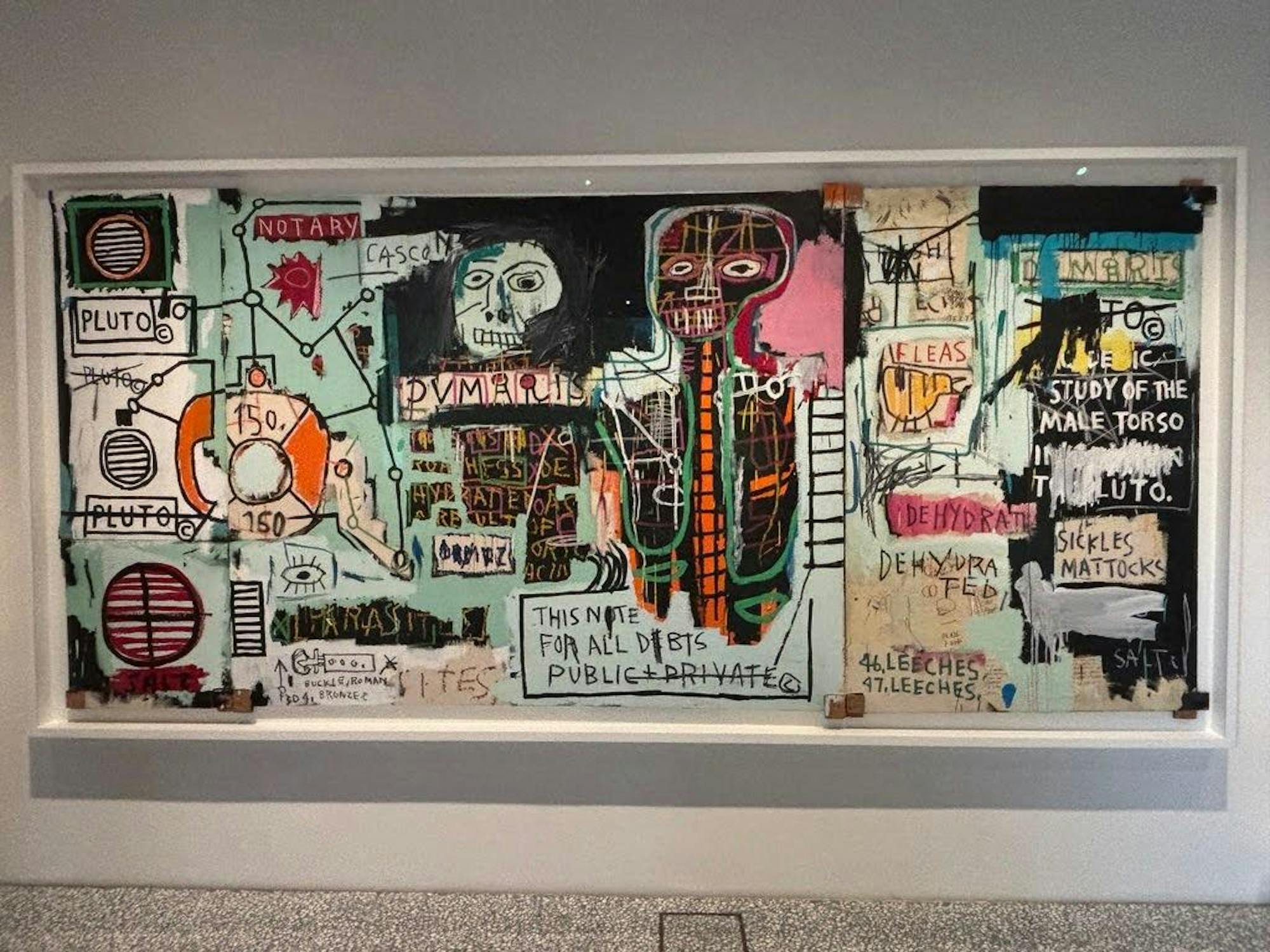 A frenzied semi-collage of overlapping words, symbols, and human figures.