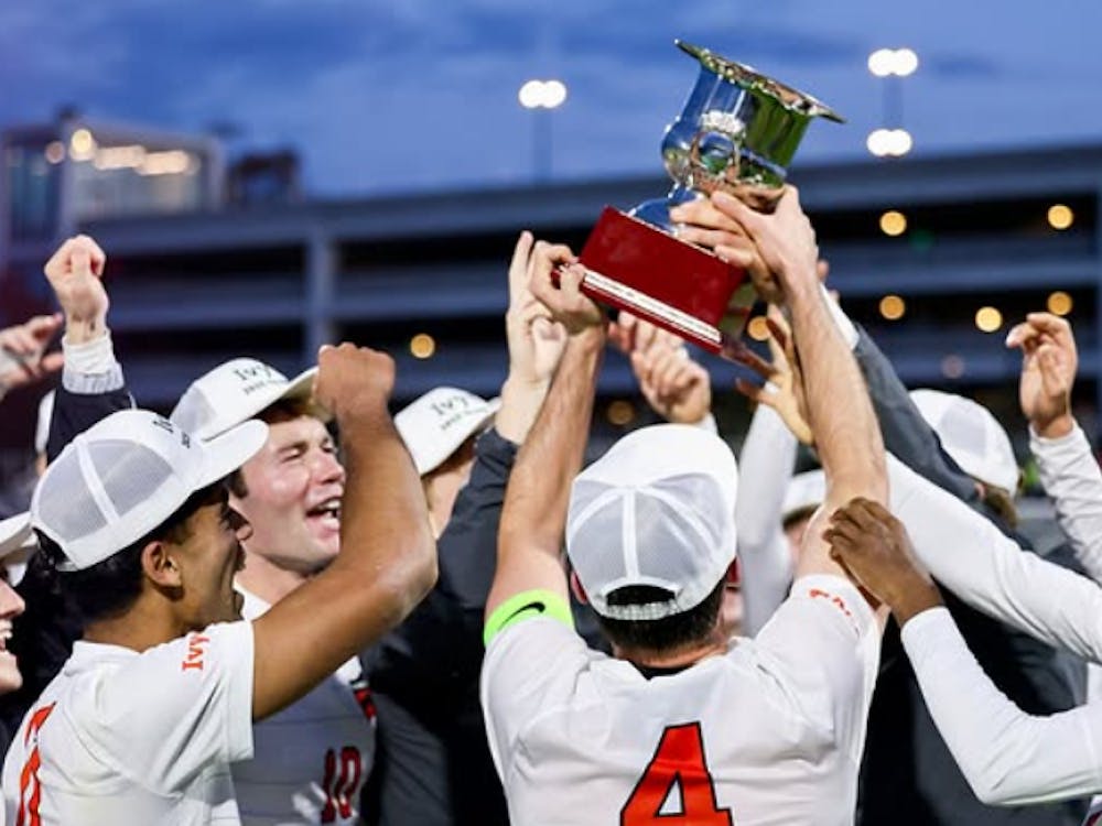 Princeton men's soccer celebrating with the Ivy League trophy.