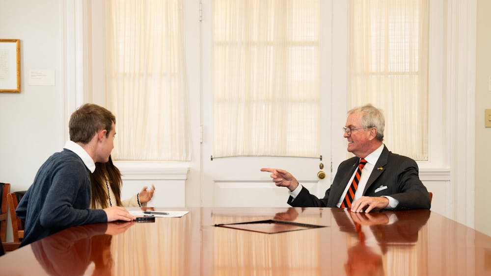 'Prince' reporters Luke Grippo and Sena Chang (left) sitting with Governor Phil Murphy (right) at a table in Joseph Henry House.