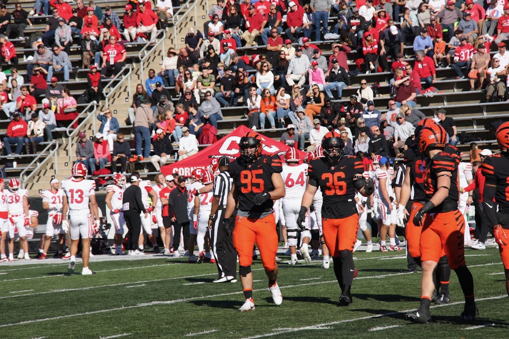 princeton players in between a play as cornell switches some players off the field