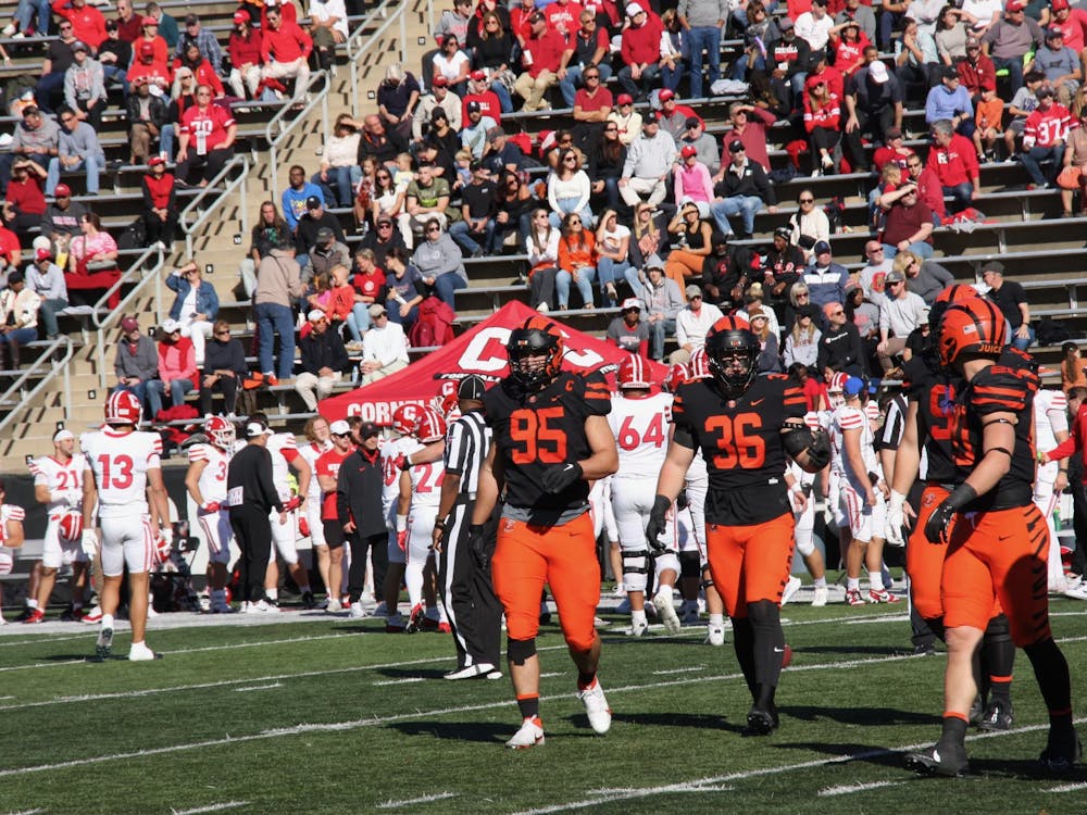 princeton players in between a play as cornell switches some players off the field