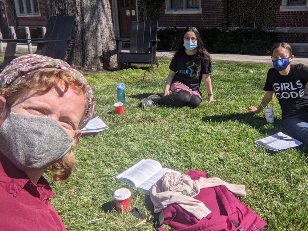 Students sit outside with Shira Kahn, Co-Director and Torah Educator of OU Seif Jewish Learning Initiative
Courtesy of Debra Orel, Event and Marketing Manager for the Center for Jewish Life