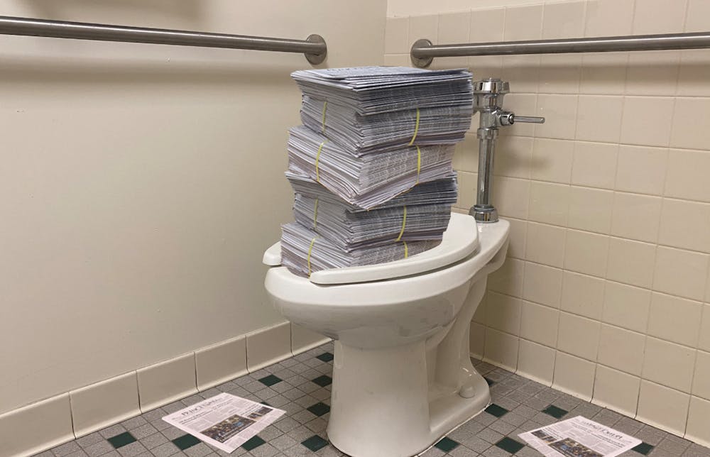 <h5>A campus toilet overflows with copies of the ‘Prince’ weekly print issue.</h5>
<h6>Zachary Shevin / The Daily Princetonian</h6>