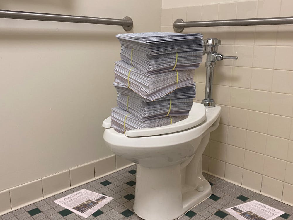 A campus toilet overflows with copies of the ‘Prince’ weekly print issue.
Zachary Shevin / The Daily Princetonian