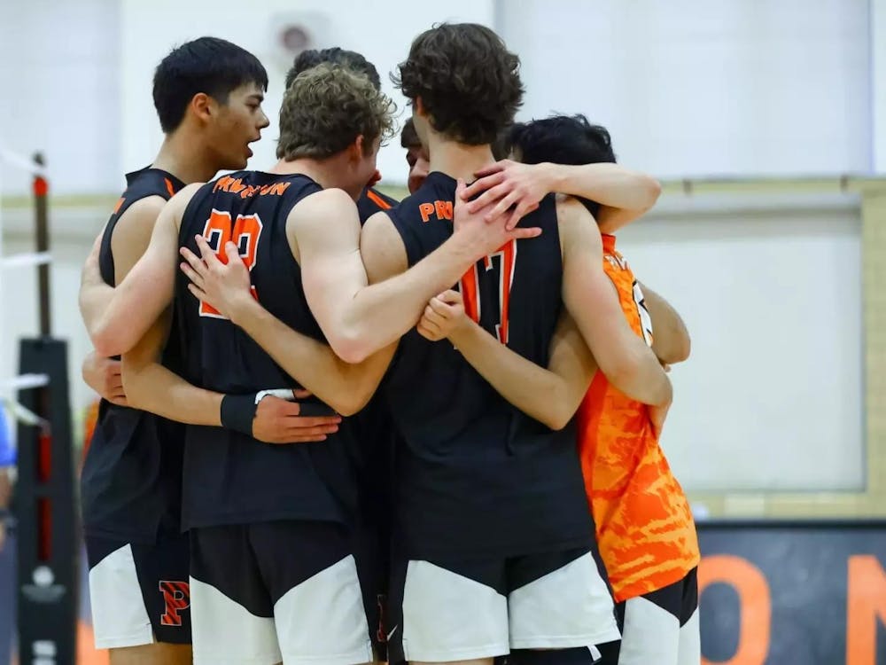A group of volleyball players strategizing their next play.
