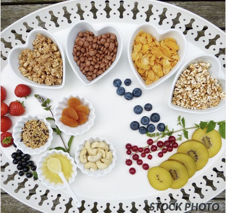 A vegan plate filled with delicious fruits and nuts