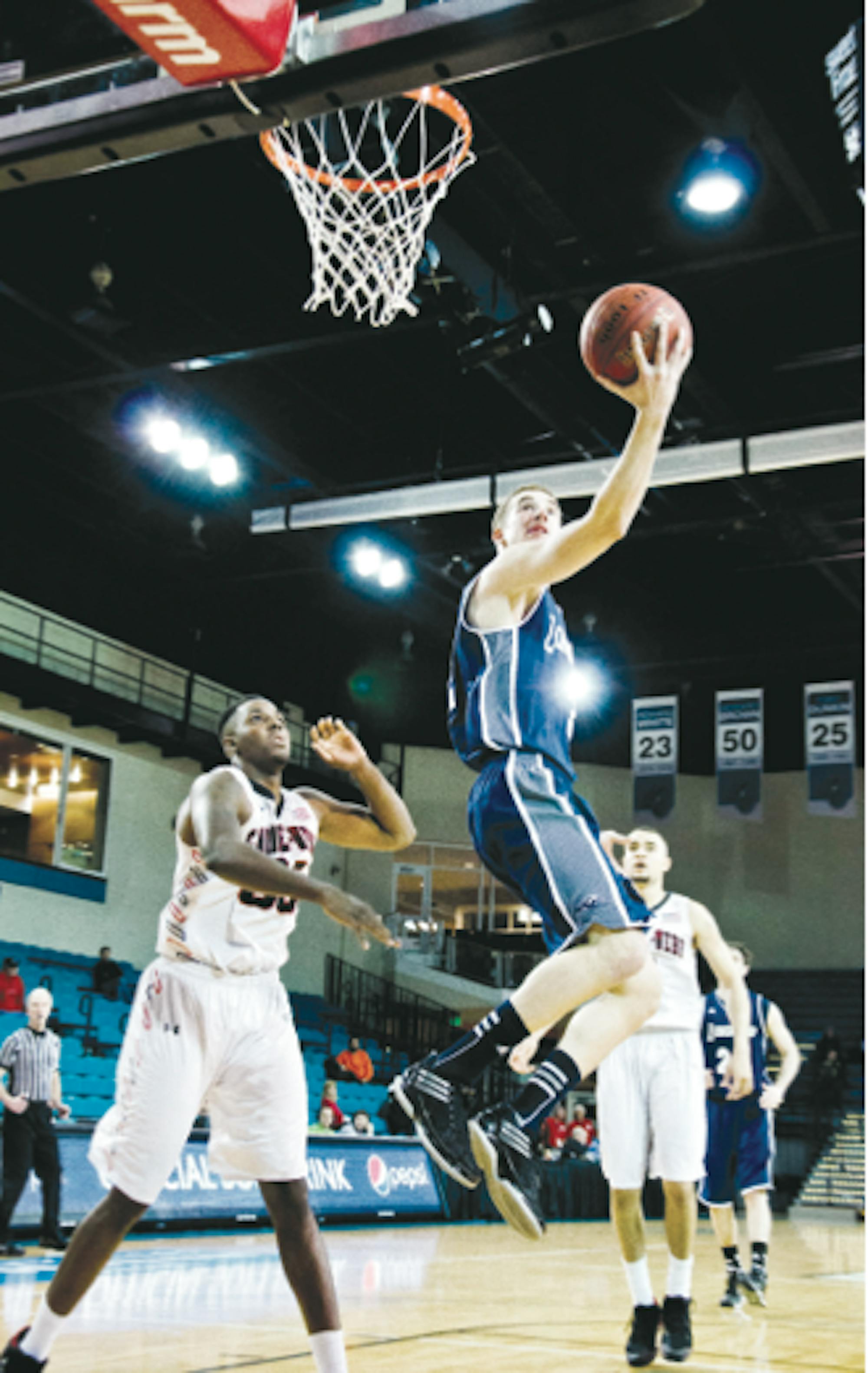 Sophomore Lucas Woodhouse goes for a layup during the Big South Conference Tournament.