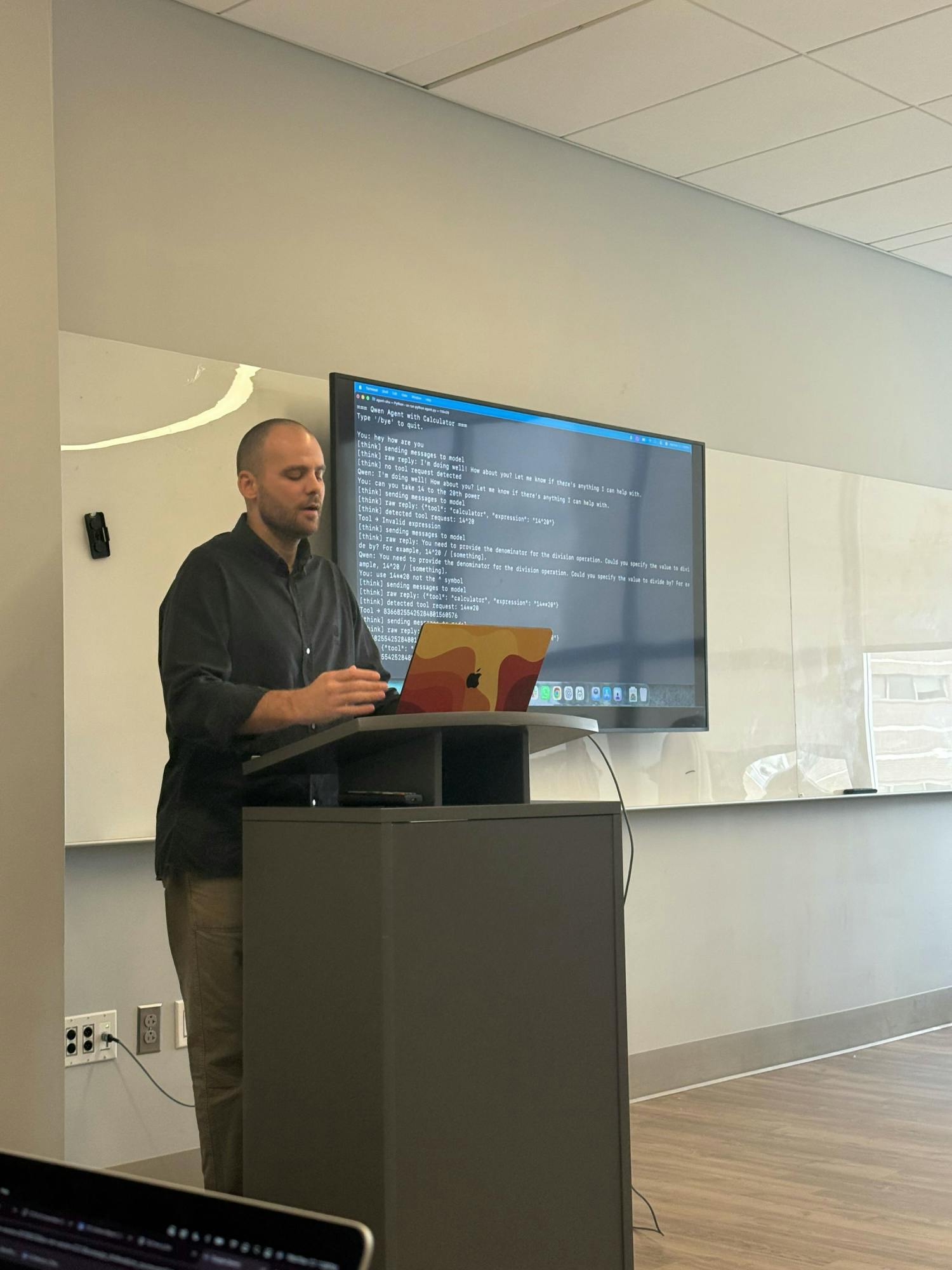 dr. joshua meyer speaking at AI event photo creds Morgan Dence.png