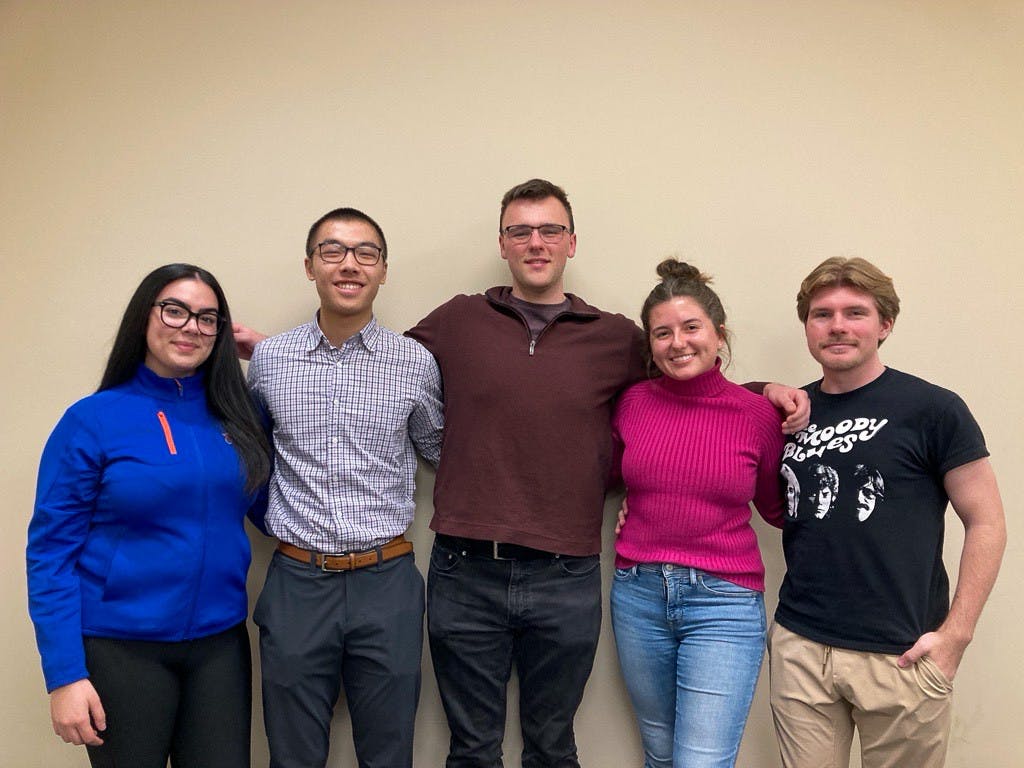 Economics Club E-Board members Michelle Delgado, Justin Kwok, Matthew James, Emilia Fedasz, and Connor Powers (From left to right) | Photo by Heaven Ferdinando