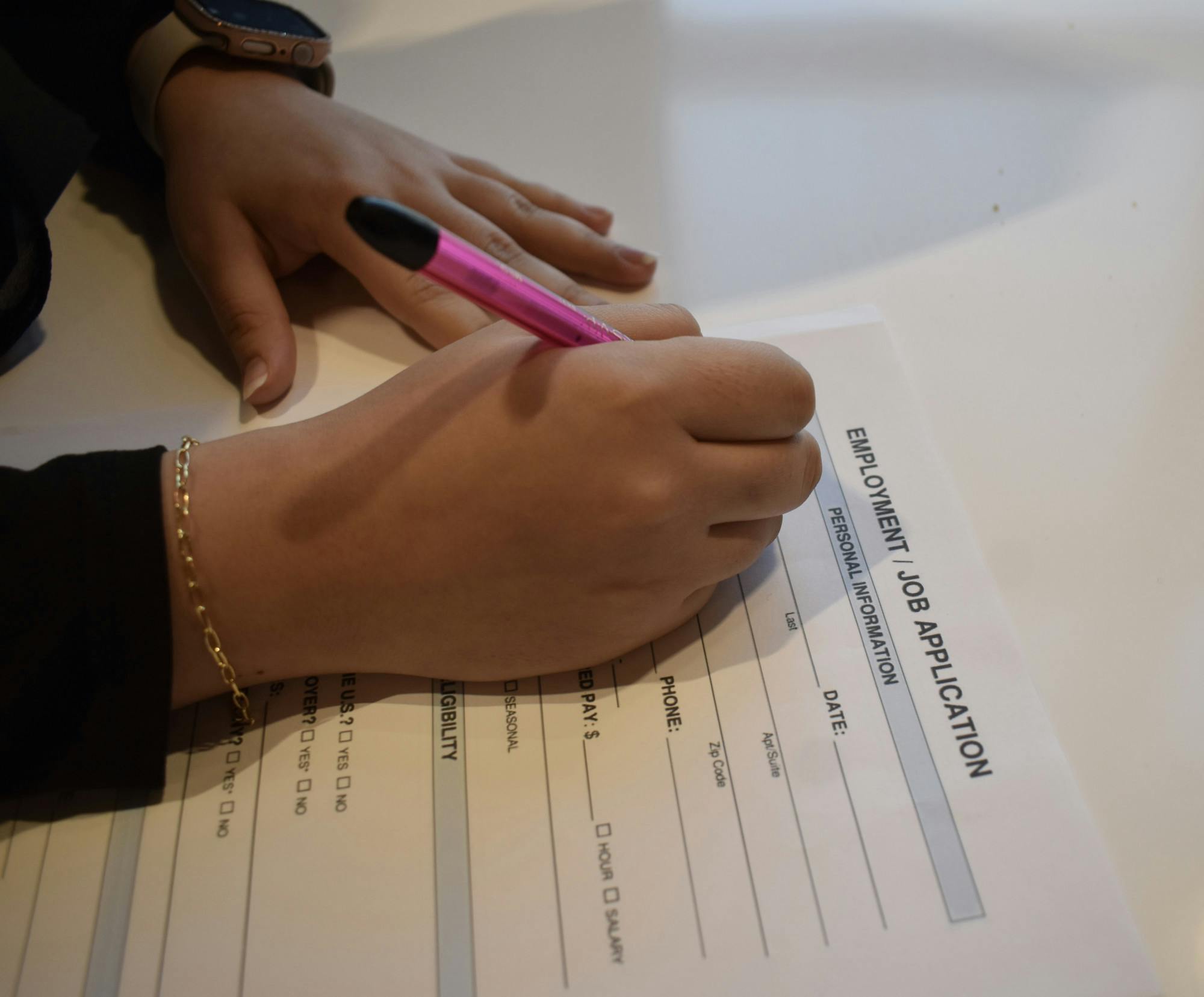 Student filling out a job application | Photo by Sarah Prosetti