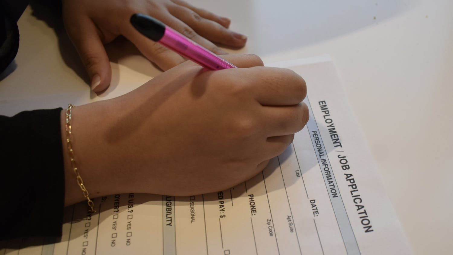 Student filling out a job application | Photo by Sarah Prosetti