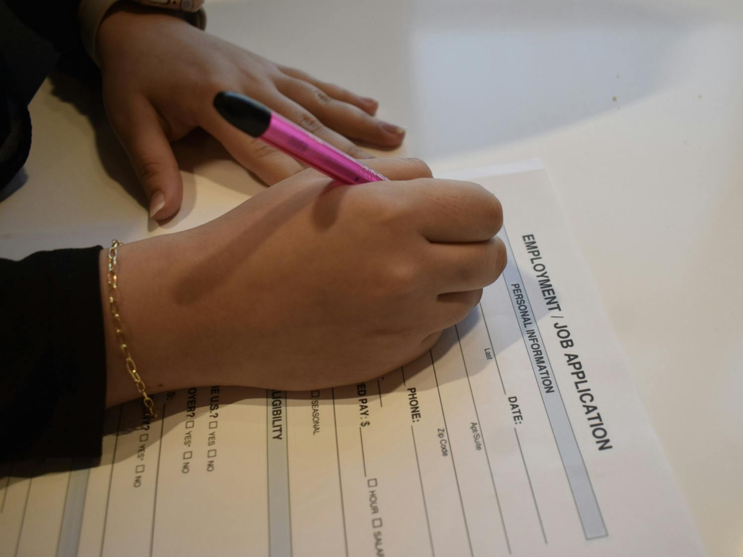 Student filling out a job application | Photo by Sarah Prosetti