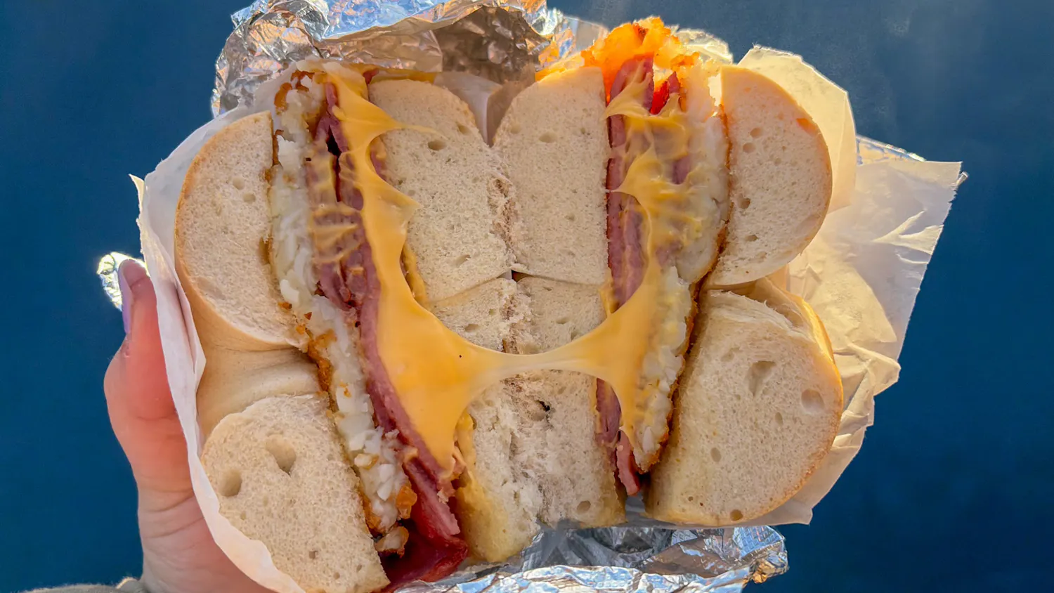 Taylor Ham, cheese and hash brown breakfast sandwich on a bagel _ Photo by Sofia Kasbo.jpg