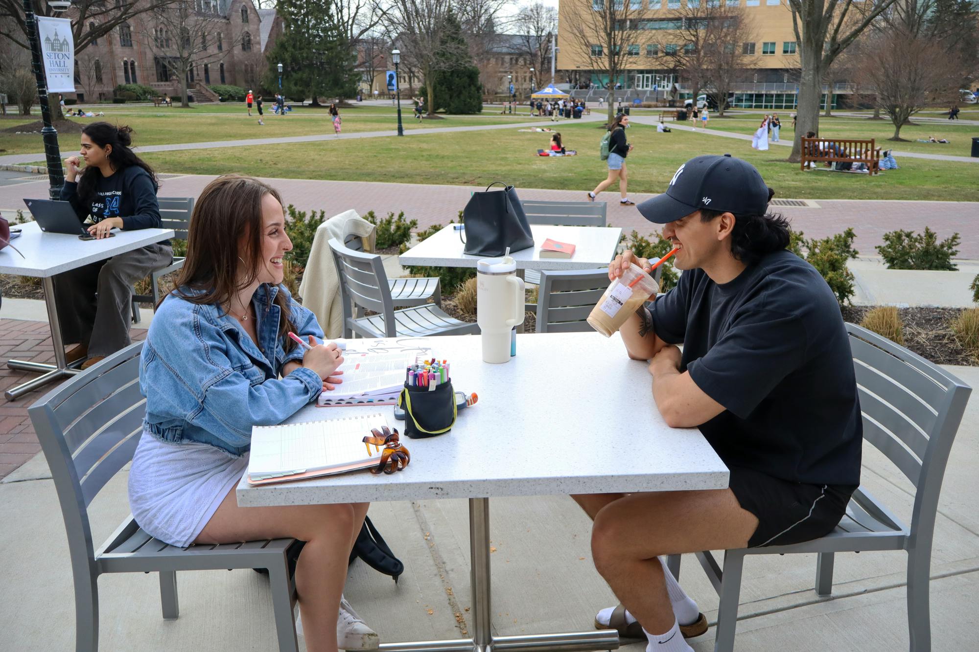 Students enjoying the weather outside on the UC patio | Photo by Benjamin Pendolino