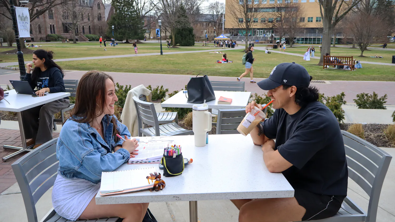 Students enjoying the weather outside on the UC patio | Photo by Benjamin Pendolino