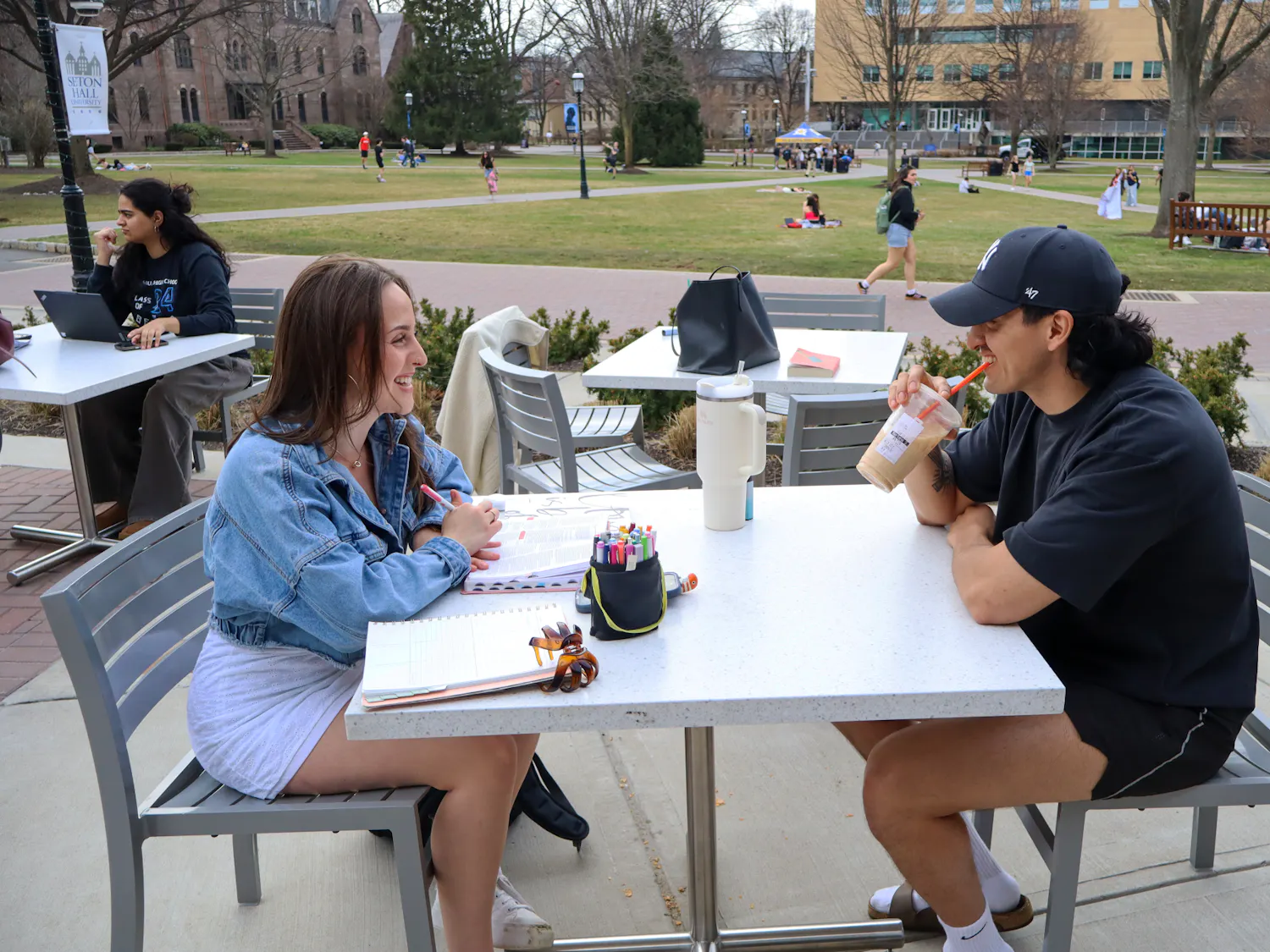 Students enjoying the weather outside on the UC patio | Photo by Benjamin Pendolino
