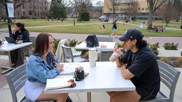 Students enjoying the weather outside on the UC patio | Photo by Benjamin Pendolino