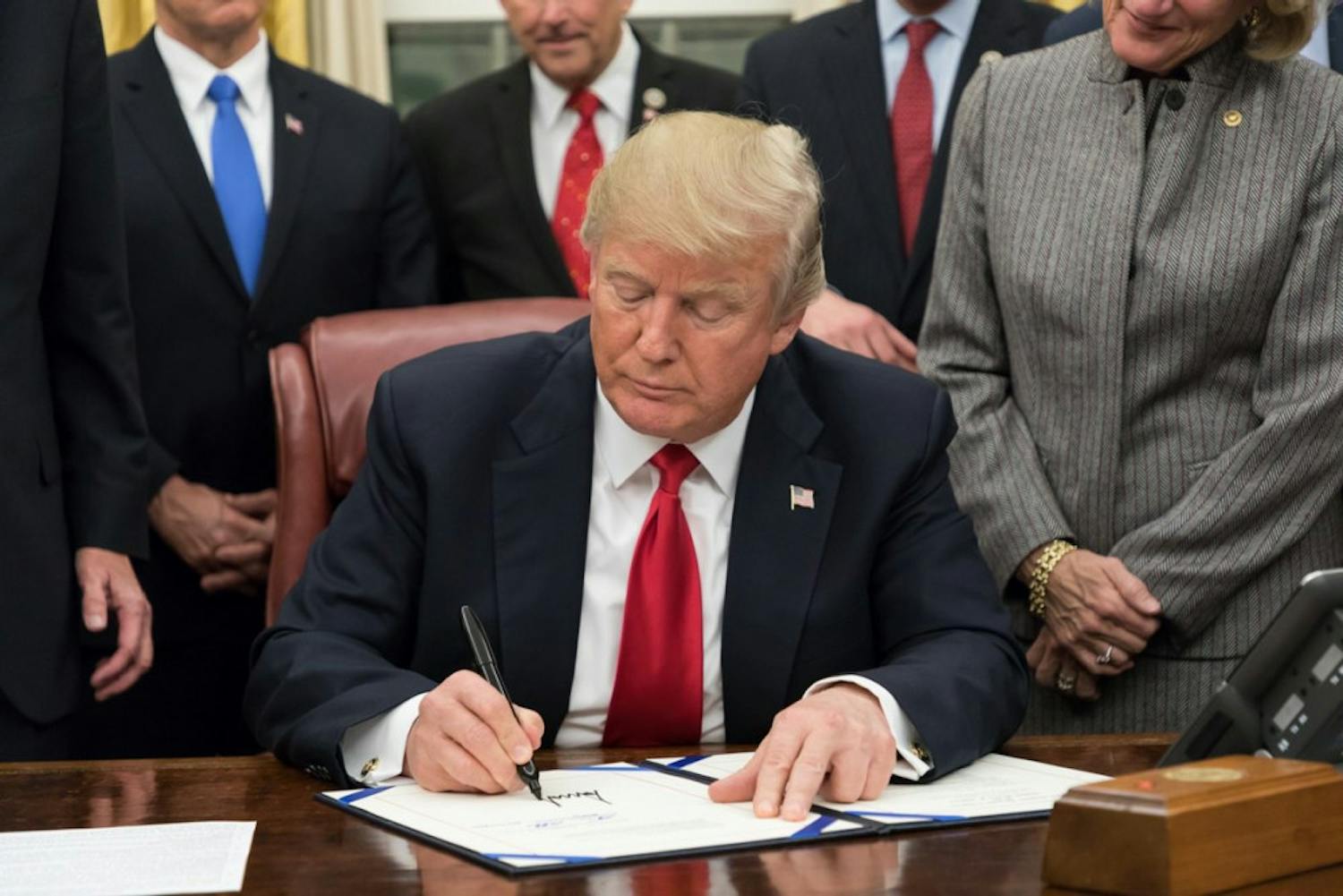 Trump-Signing-Random-Bill-via-Wikimedia-Commons