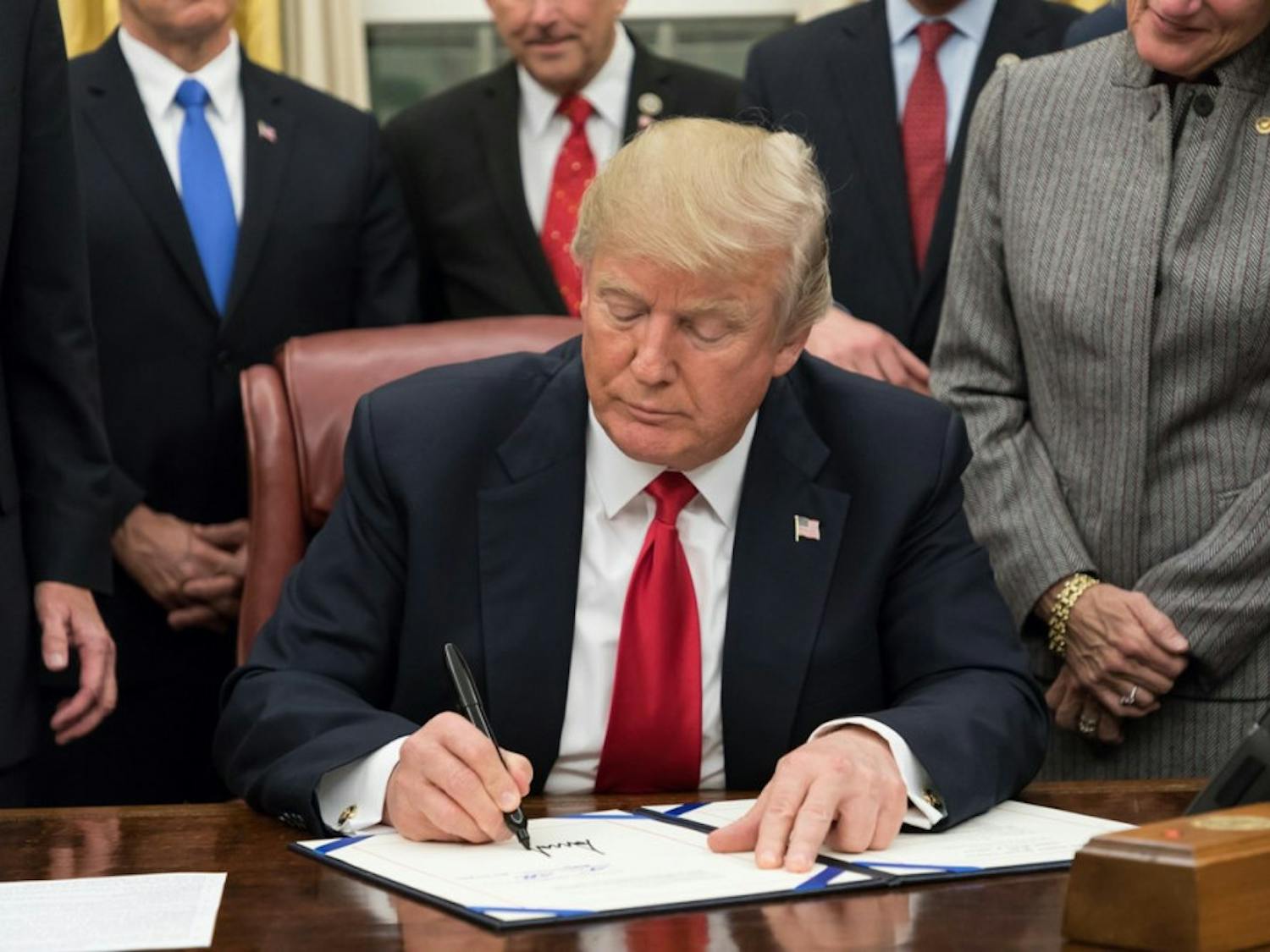 Trump-Signing-Random-Bill-via-Wikimedia-Commons