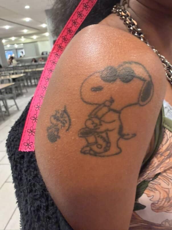 Snoopy Playing the Saxophone Tattoo | Photo via Amara McCowan