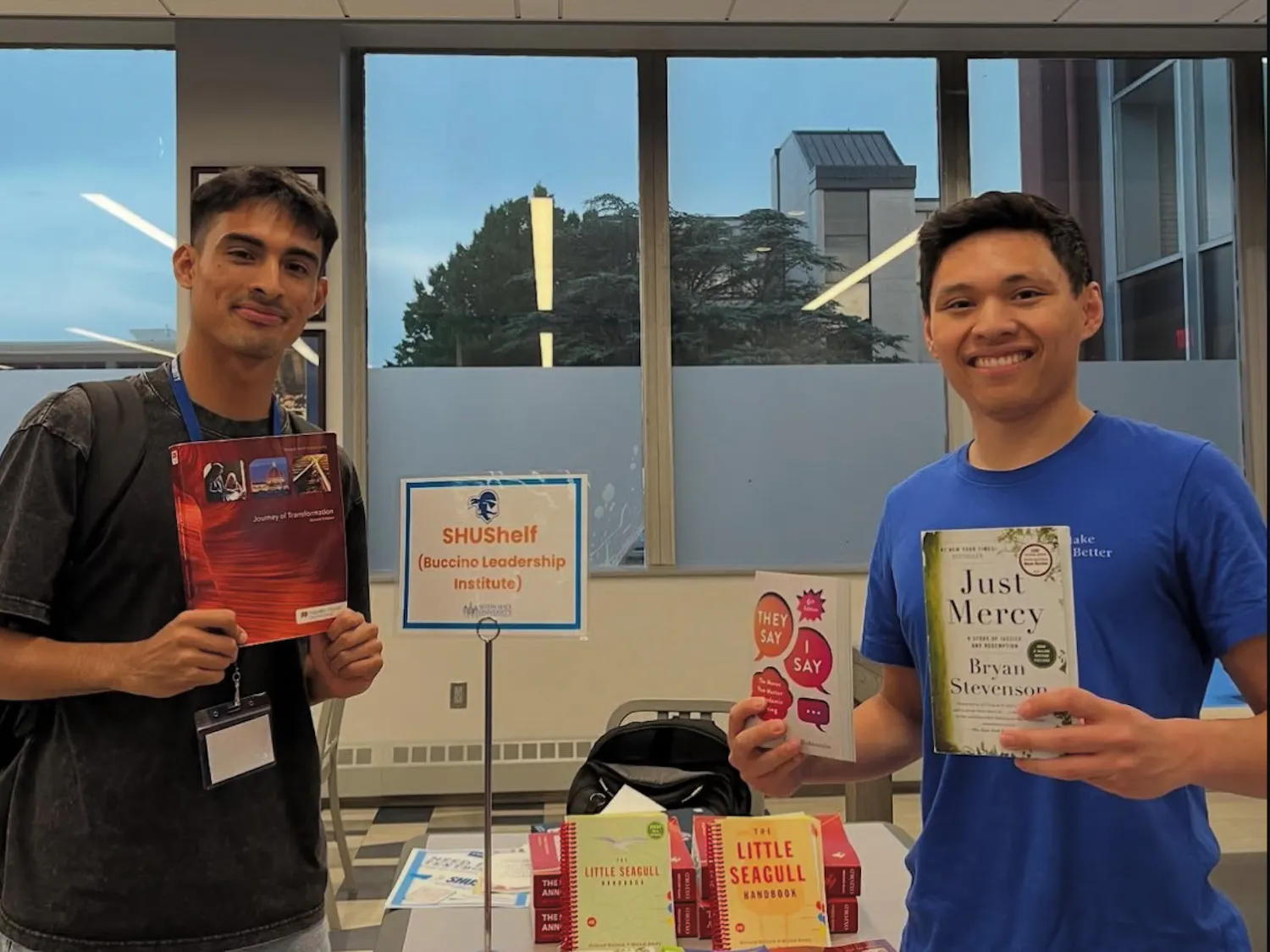 Ed Vela of SHU Shelf giving out textbooks | Photo provided by SHU Shelf
