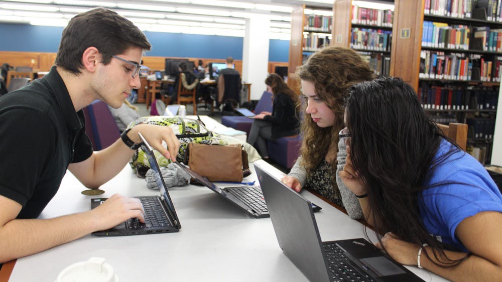 cropped-Students-Studying-in-Library