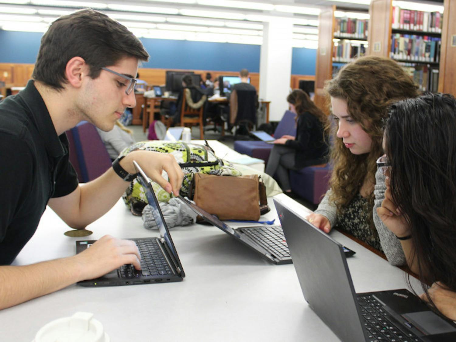 cropped-Students-Studying-in-Library