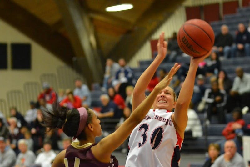 	Jen Kalinowski goes up for the lay-up in the first half. 