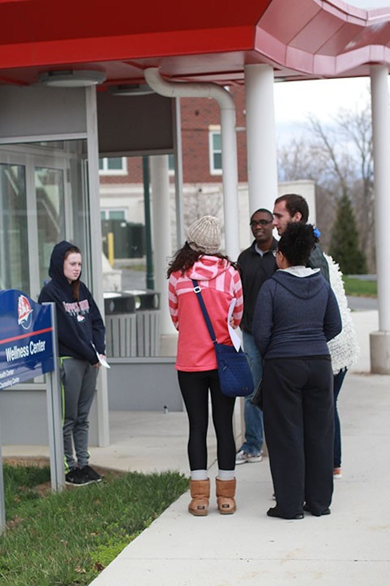 Students participating stop outside Etter Health Center to discuss disability issues at SU.