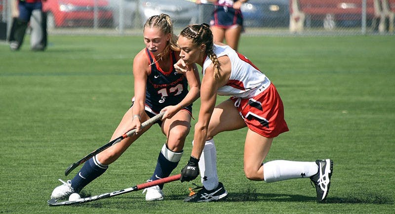 Adrienne McGarrigle battles for possession with a Mercyhurst defender.