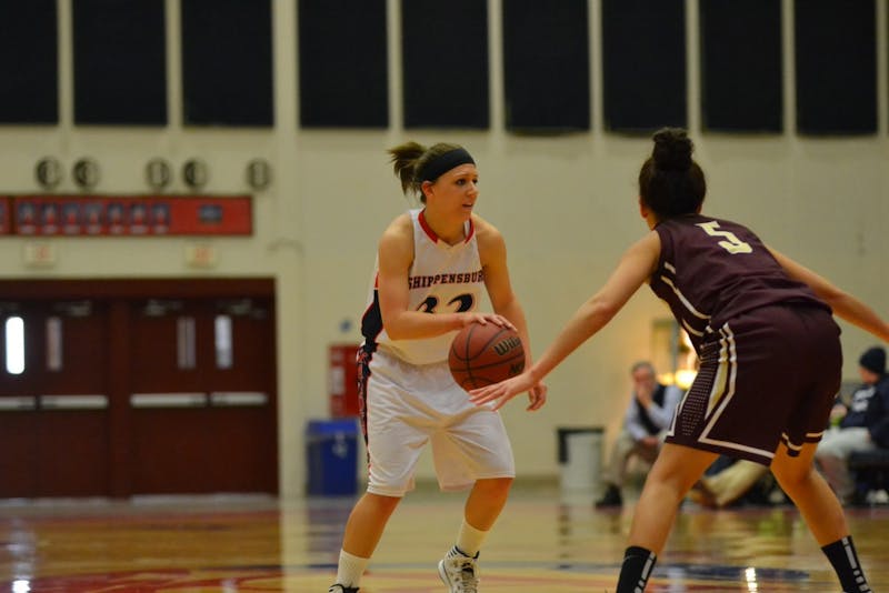 	Sarah Strybuc looks for an open Raider teammate in the first half of Saturdays game. 