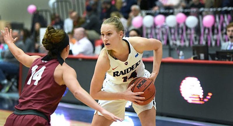 Lauren Mills (right) squares up against a defender in Saturday’s contest at Mansfield on her way to scoring 18 points, a new career-high for the SU freshman.