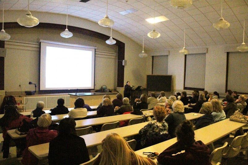 A. Richardson expresses her love for quilts in her lecture.