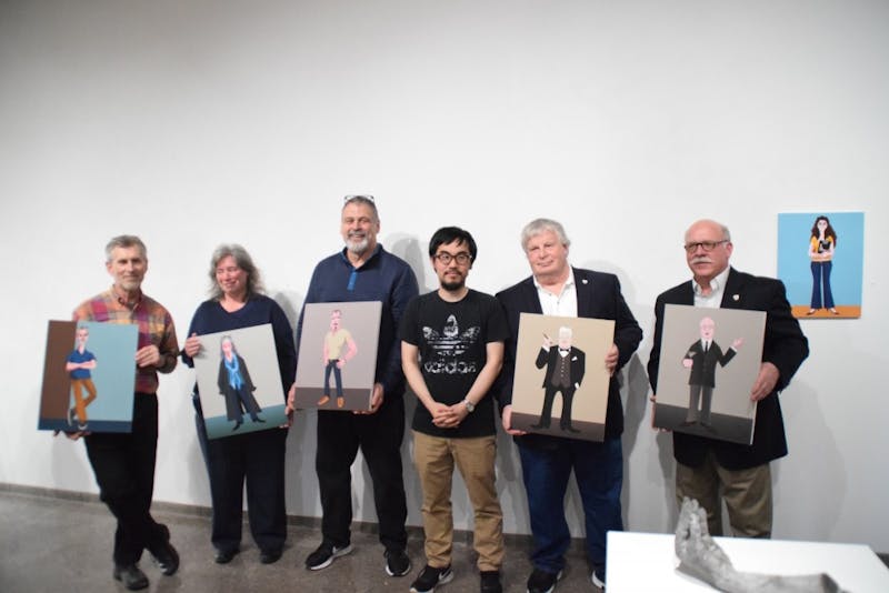 The art and design professors hold their corresponding digital prints with artist Dietrich Grabauskas (left to right): Ben Culbertson, Kathryn Keely, Steve Dolbin, Grabauskas, William Whiteley and Michael Campbell.