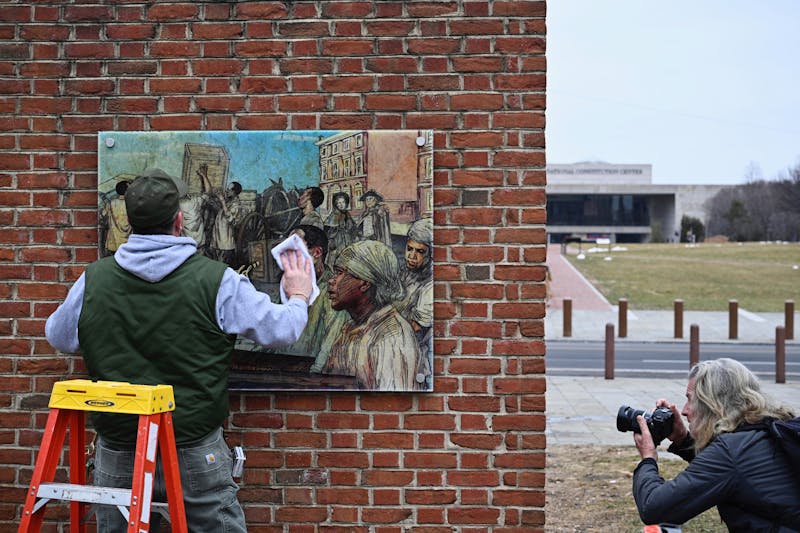Panels that were part of an exhibit on slavery at the President's House Site in Philadelphia are put back Thursday, Feb. 19, 2026. (AP Photo/Joe Lamberti)