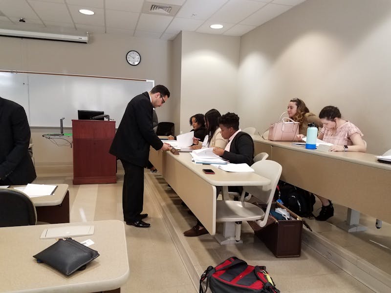 Adolfo Alvarez confers with defense co-counsel: from left to right, Alexia&nbsp;
Barbour, Ryasia Deshields and Monae Bullock, prior to opening statements.