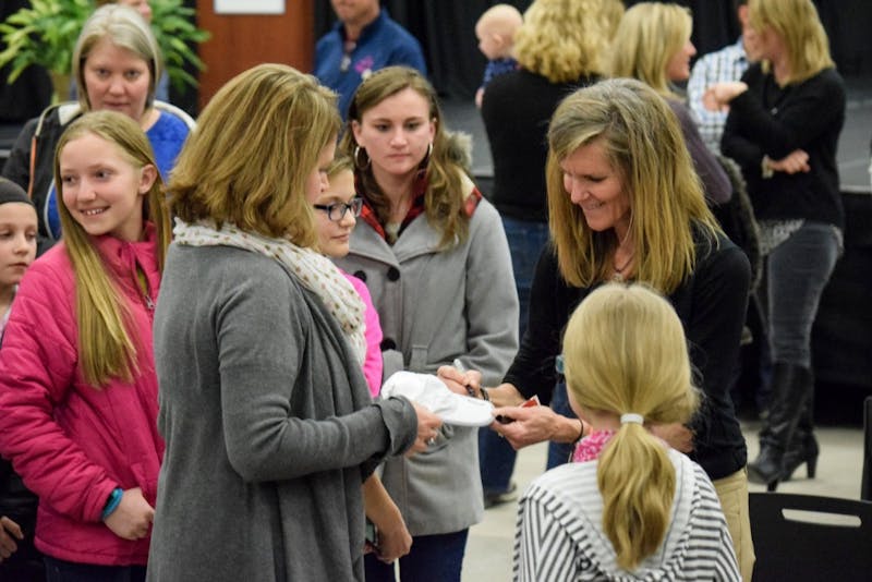 Molly Barker meets with guests and autographs memorabilia.