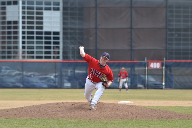 Junior pitcher Thomas Swartz delivers a pitch.