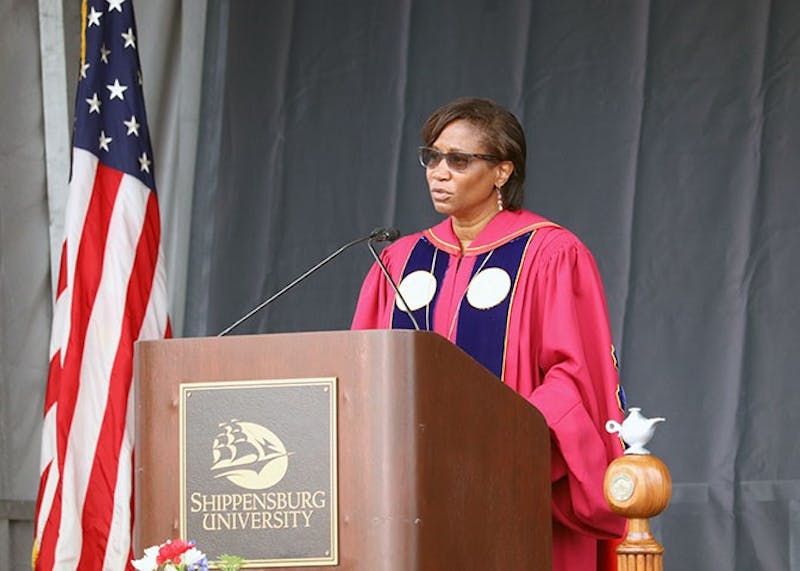 Shippensburg University President Laurie Carter greets graduates and their families at the combined ceremony.