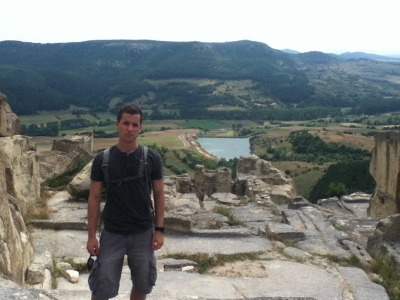 	Cadet Devon Newcomer in Bulgaria on an ancient ruin during a CULP mission.