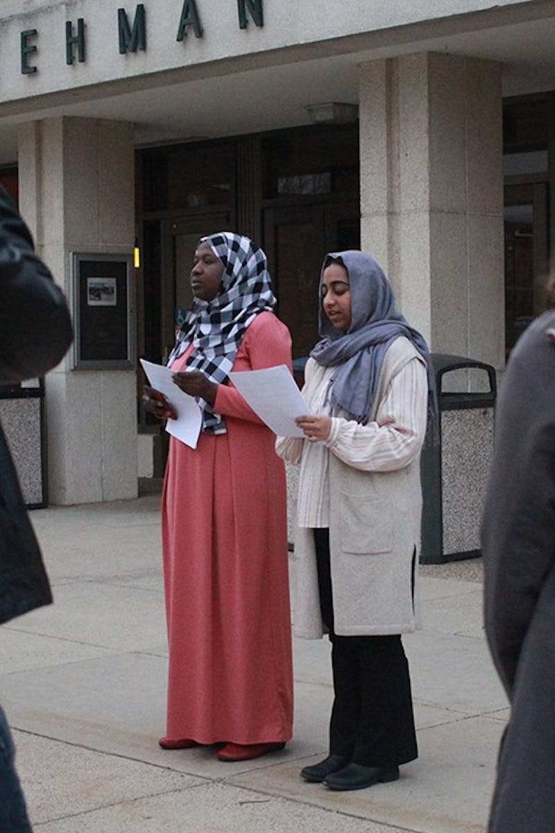 Amadou Kindo (left) and Kanza Amin remember 
victims of the mass shooting in New Zealand.